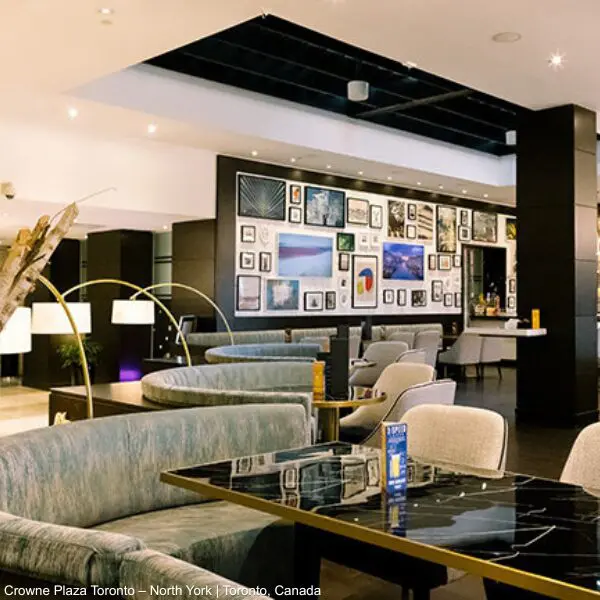 IHG modern hotel lounge with marble tables, perfect for business travellers and events.
